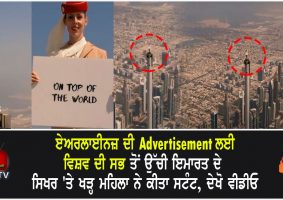 woman stands on top of burj khalifa