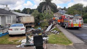 truck crashes into auckland houses