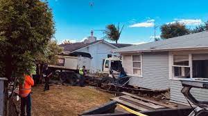 truck crashes into auckland houses